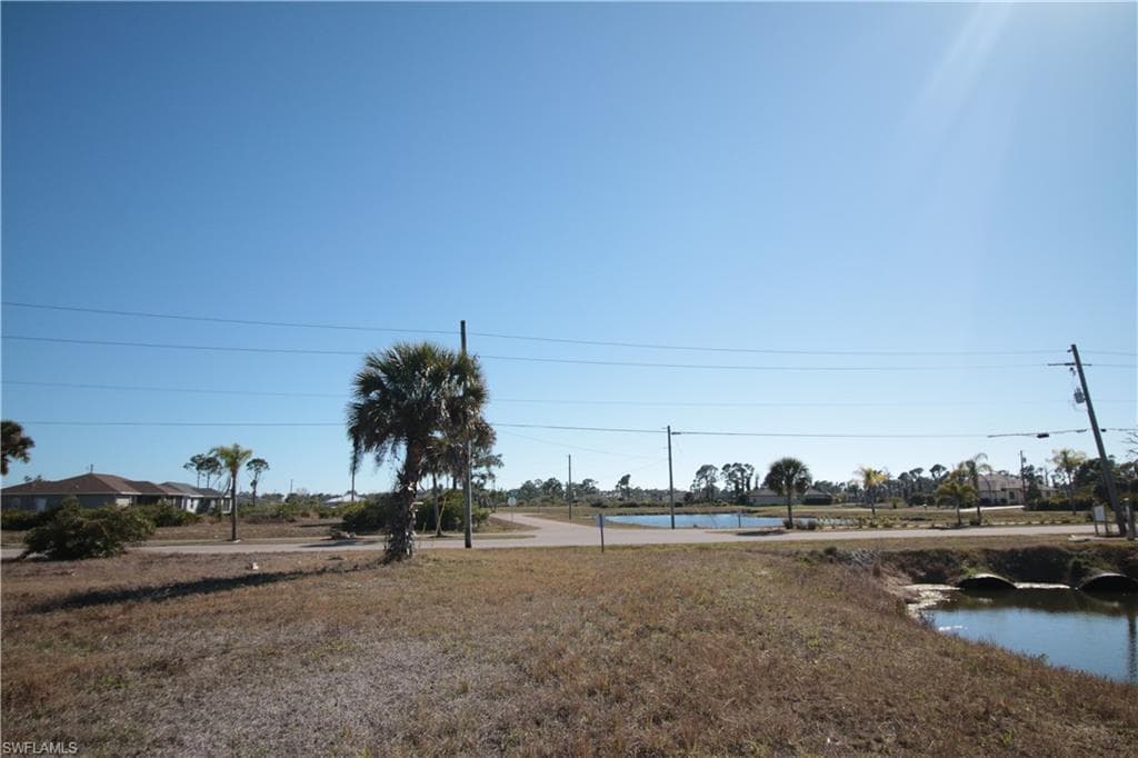 View of grassy yard featuring a water view