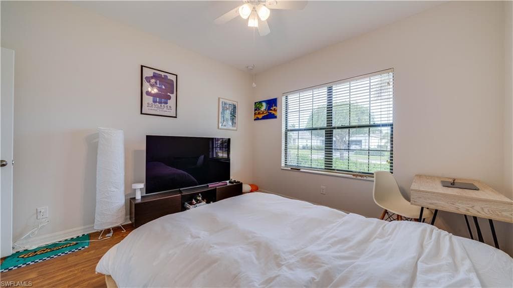 Bedroom featuring light wood-style floors and ceiling fan
