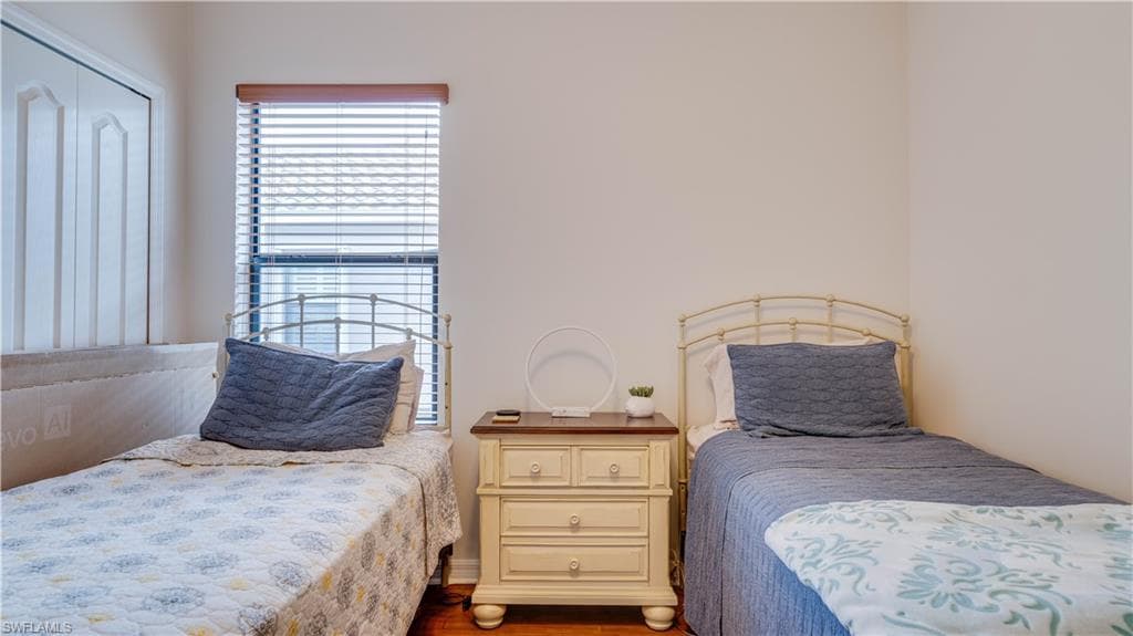 Bedroom with wood finished floors