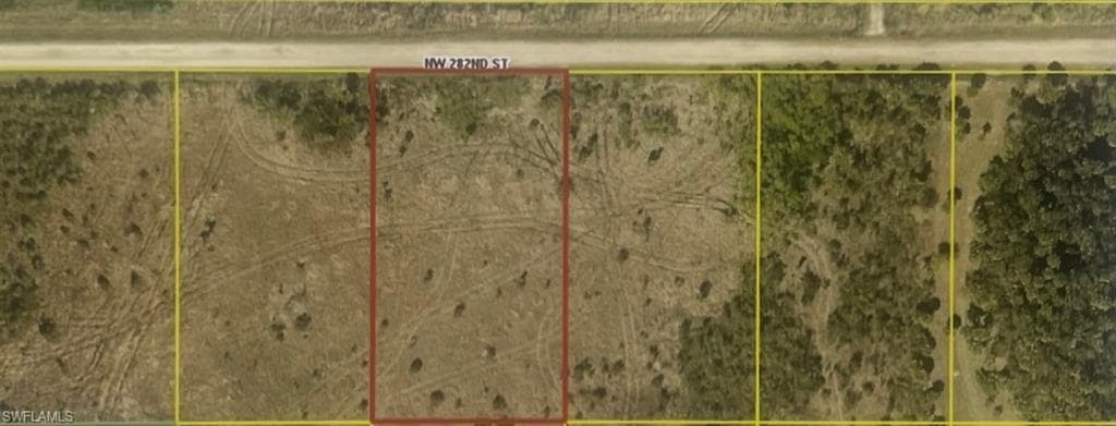 Aerial overview of property's location with property parcel outlined