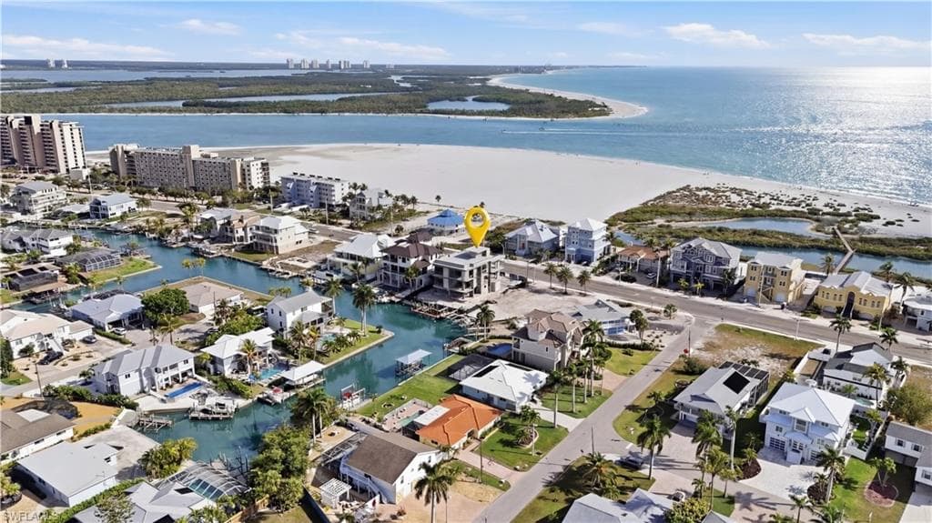 Aerial perspective of suburban area with a nearby body of water - Virtually Edited Image