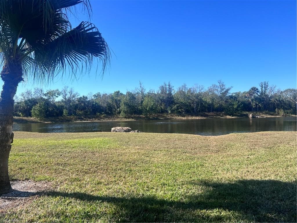 View of green lawn with a water view