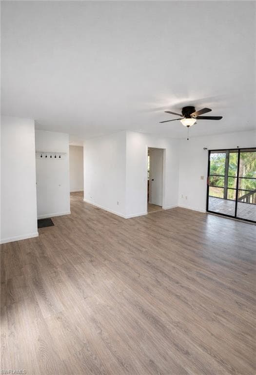 Unfurnished room with light wood-style floors and ceiling fan