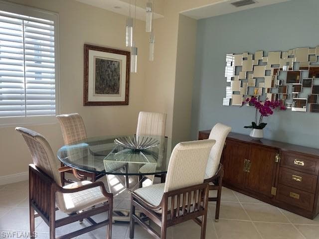 Dining space with light tiled floor