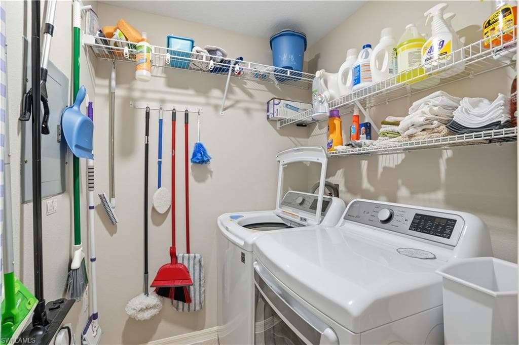 Laundry area with washing machine and clothes dryer