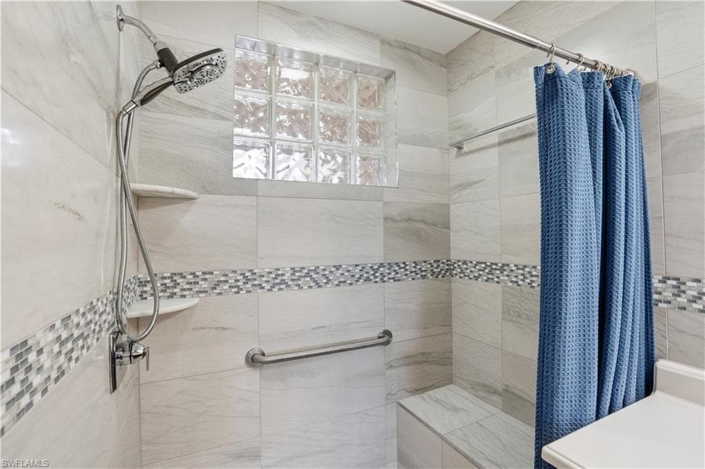 Bathroom with tiled shower