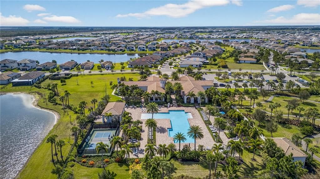 Aerial perspective of suburban area with a nearby body of water