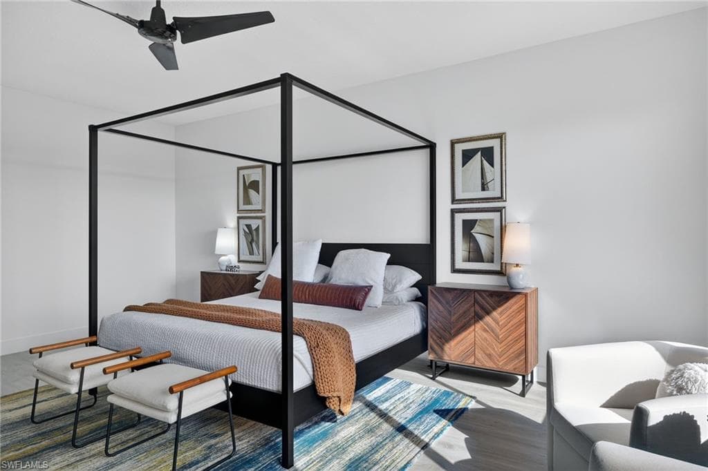 Bedroom featuring a ceiling fan and wood finished floors