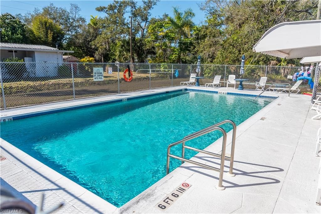 Community pool with a patio area