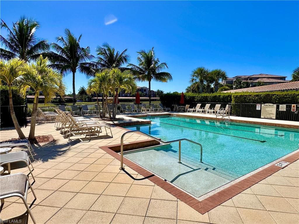 Community neighborhood pool with a patio