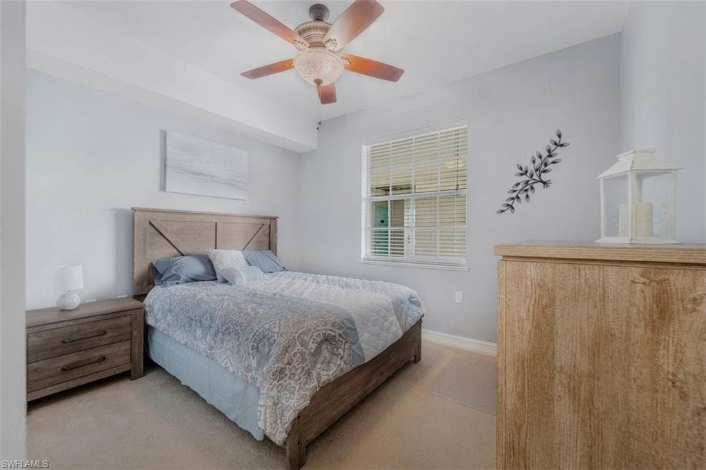 Recessed lighting, ceiling fan with illumination, window with blinds, and light-colored carpeting