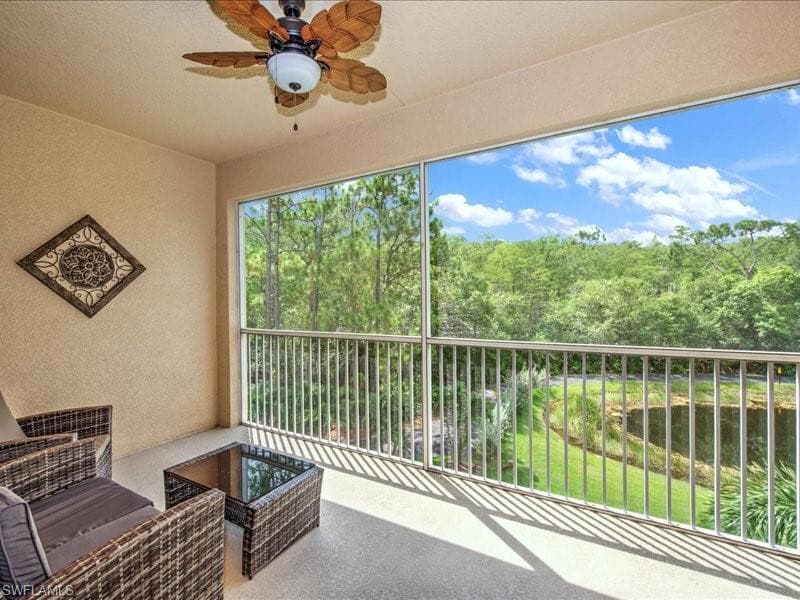 Balcony with ceiling fan and a water view