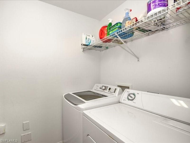 Washroom with washing machine and dryer
