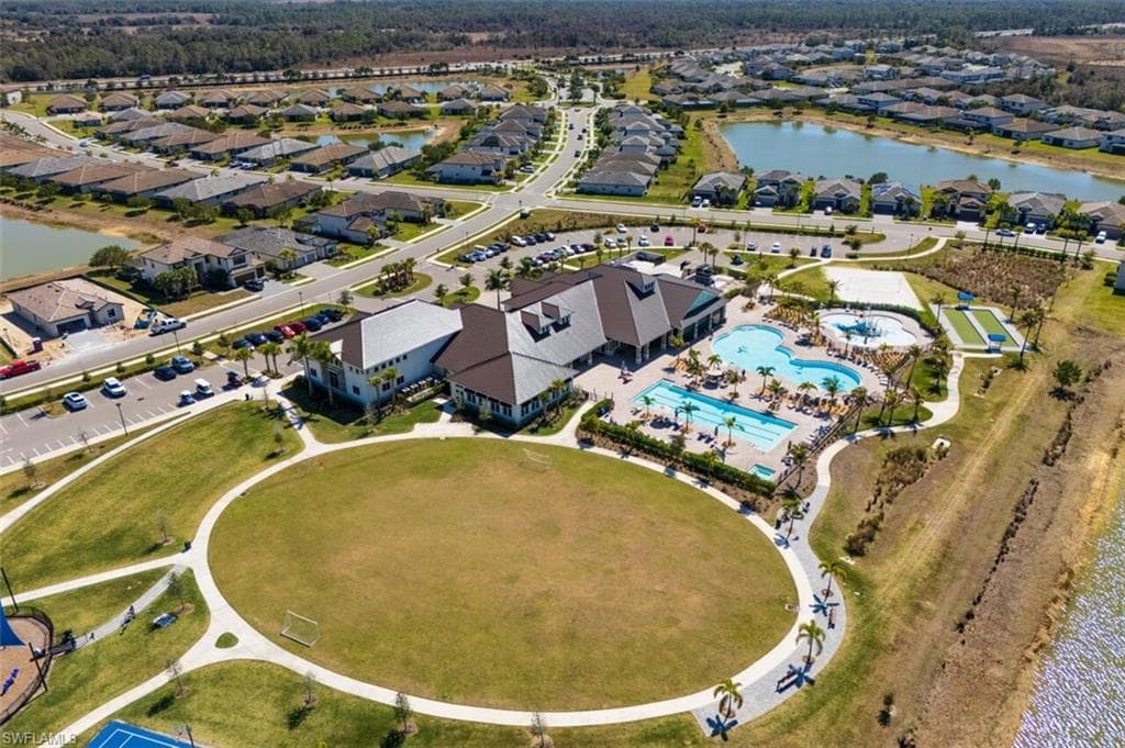 View of property location featuring a nearby body of water and nearby suburban area