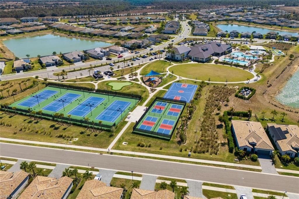 Aerial view of property's location with nearby suburban area and a nearby body of water