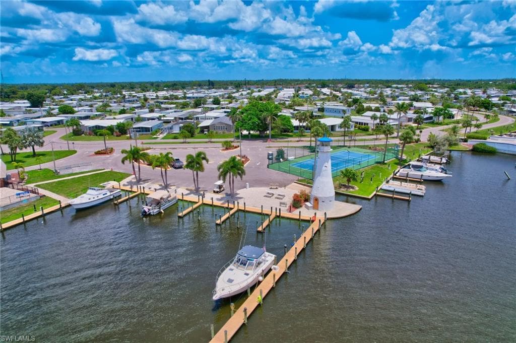 Aerial perspective of suburban area featuring a large body of water