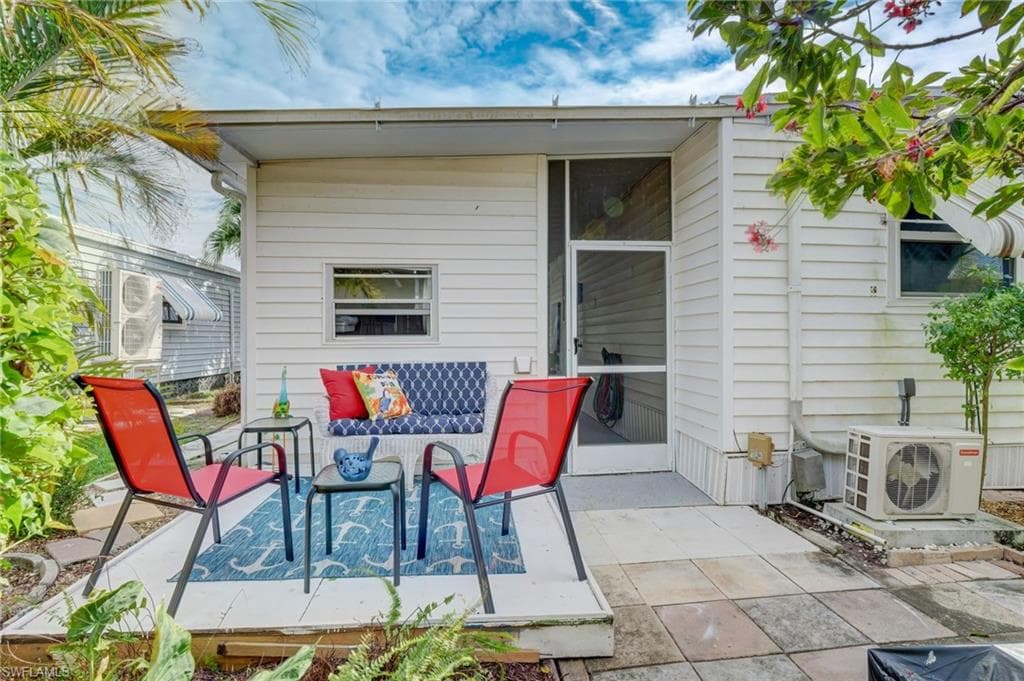 View of patio / terrace featuring a sunroom