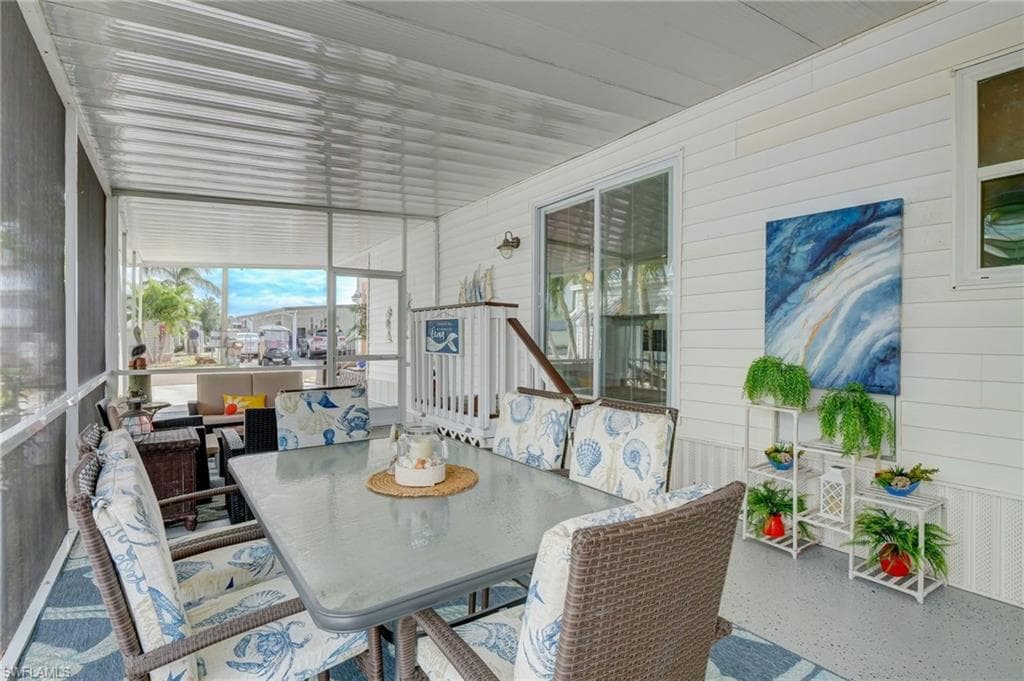 Sunroom / solarium featuring outdoor dining space