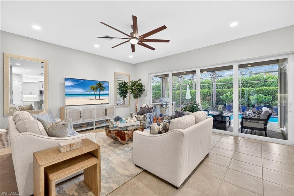 The great room is spacious , comfortably seats 7, features high hats and ceiling fan.