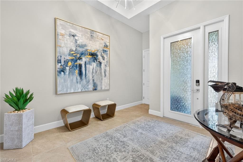 The Sierra has a grand, welcoming foyer! Window tint on front door and side window provide privacy in this all tile home...