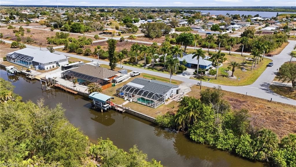 Aerial view of residential area featuring a large body of water
