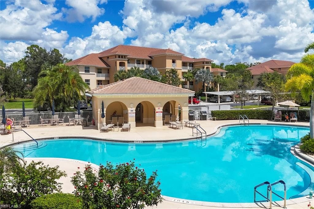 Community pool featuring a patio