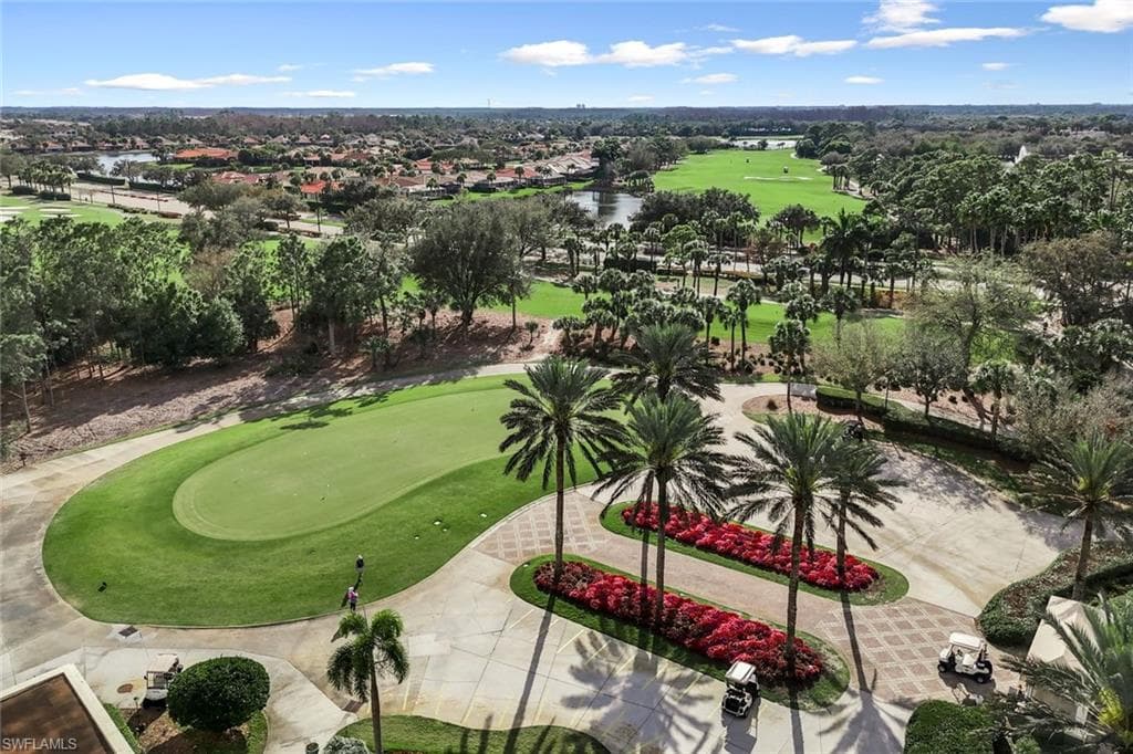 Drone / aerial view of a golf club and a nearby body of water