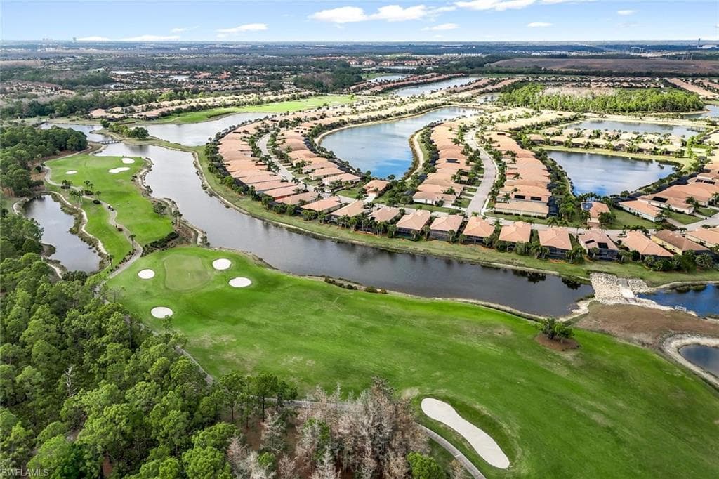 Aerial view of property's location featuring nearby suburban area and a golf club
