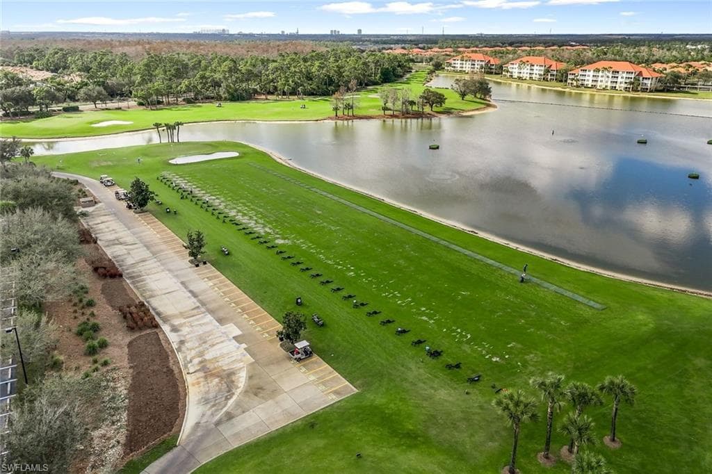 Drone / aerial view of a local golf course and a nearby body of water