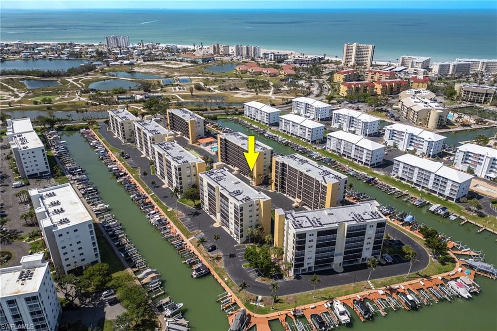 View of property location featuring a large body of water and nearby urban area