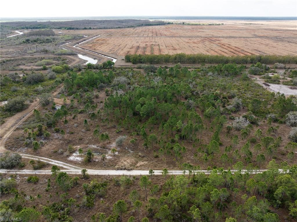 Aerial view of sparsely populated area featuring farmland
