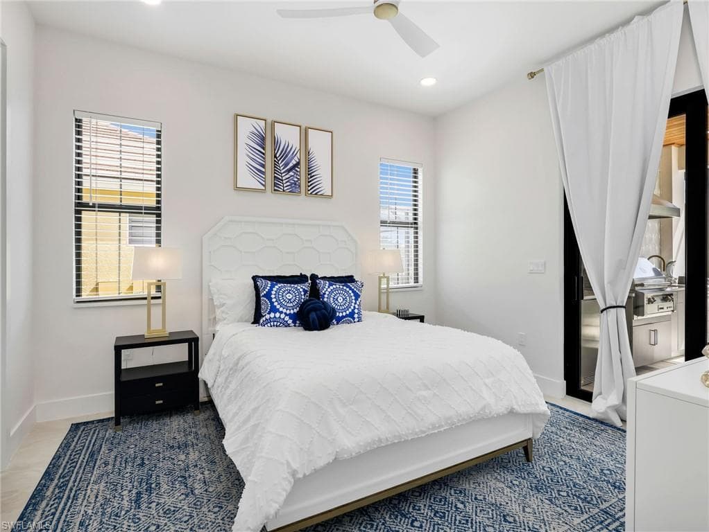 Bedroom featuring multiple windows, recessed lighting, and a ceiling fan