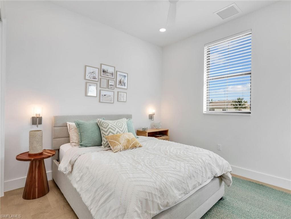 Bedroom with recessed lighting and a ceiling fan
