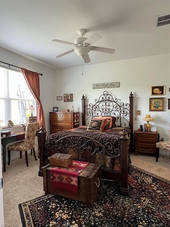 Bedroom with light carpet and ceiling fan