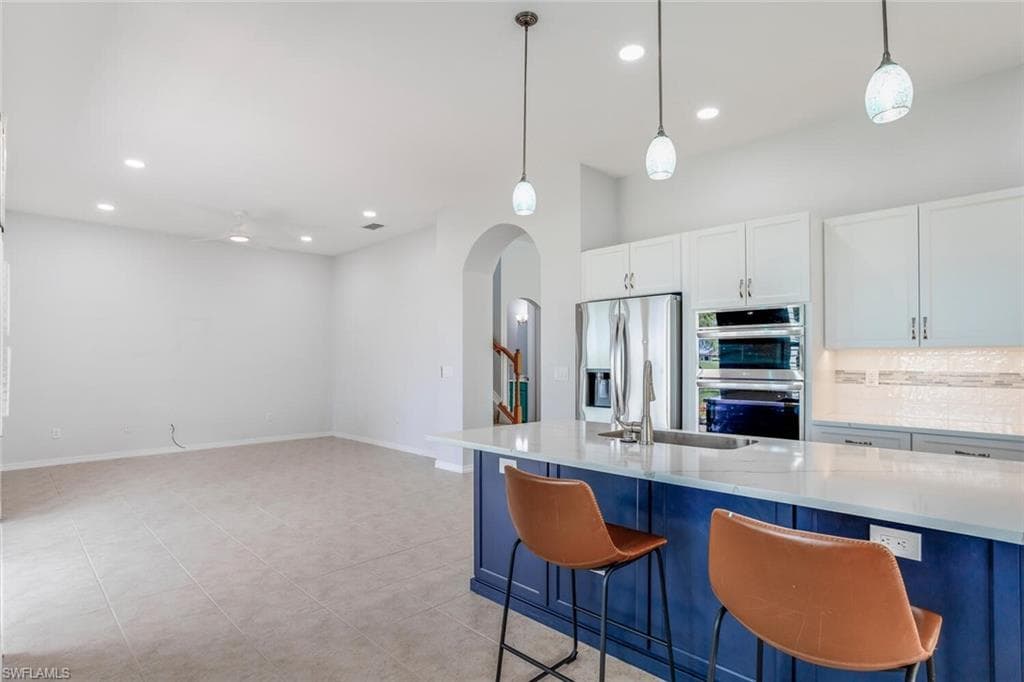 Family Room w/ Tile Flooring and Recessed Lighting