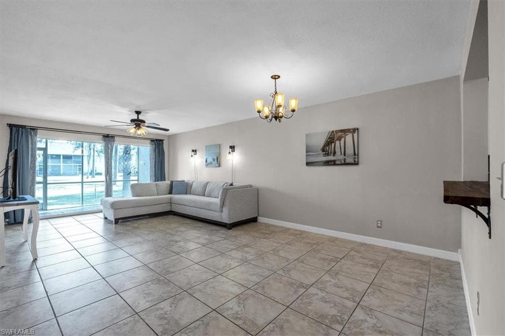 Living area with a ceiling fan and a chandelier