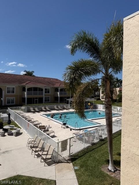 Community pool featuring a patio area