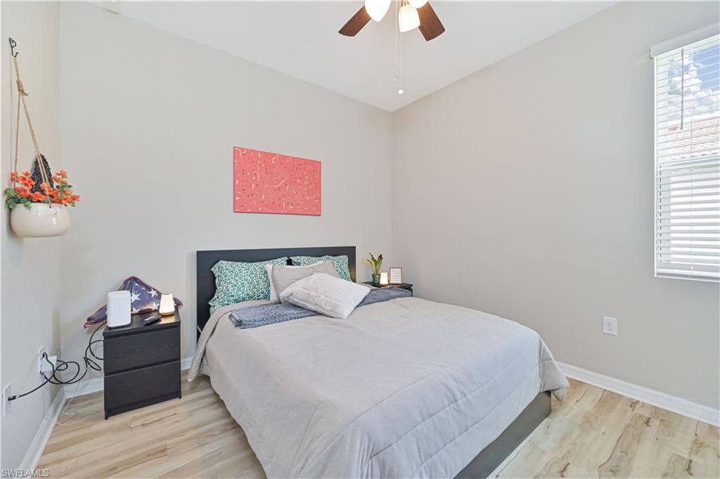 Bedroom featuring light wood-style floors and ceiling fan