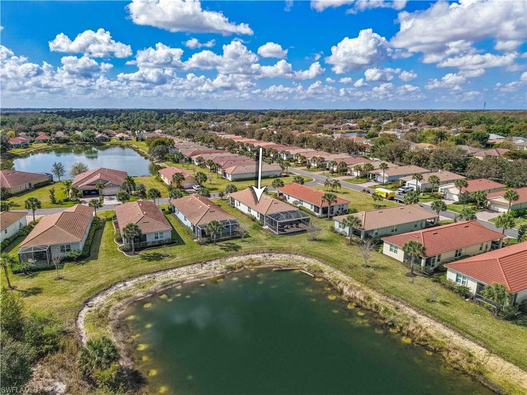 Aerial perspective of suburban area with a large body of water
