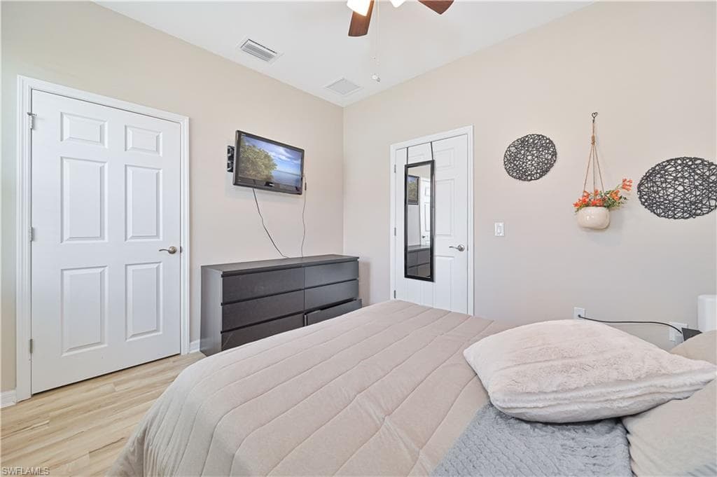 Bedroom featuring light wood finished floors and ceiling fan