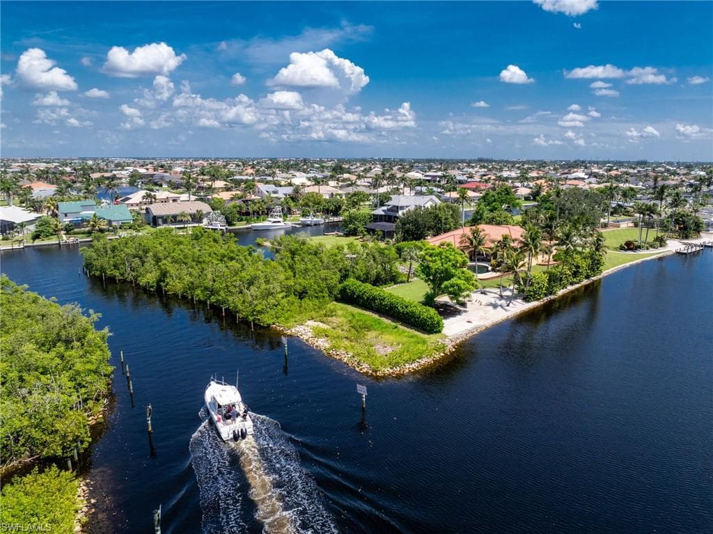 Aerial perspective of suburban area with a nearby body of water