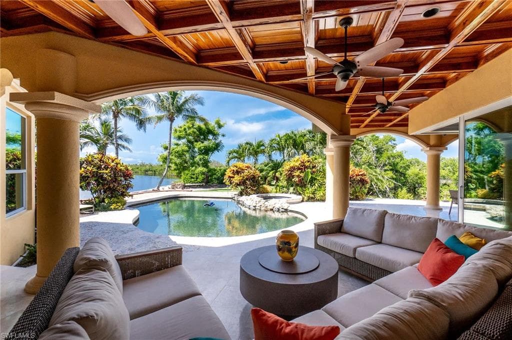 Integrated pool / hot tub with an outdoor hangout area and a patio