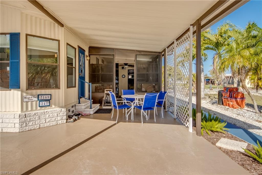 View of patio with outdoor dining area