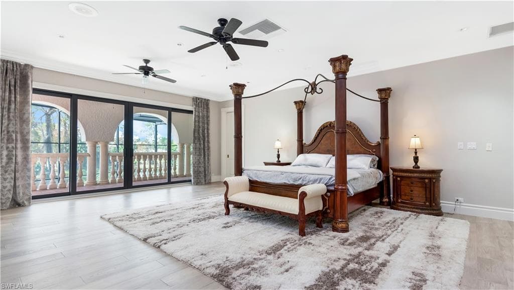 master bedroom featuring access to outside, light wood-style flooring, ceiling fan, and ornamental molding