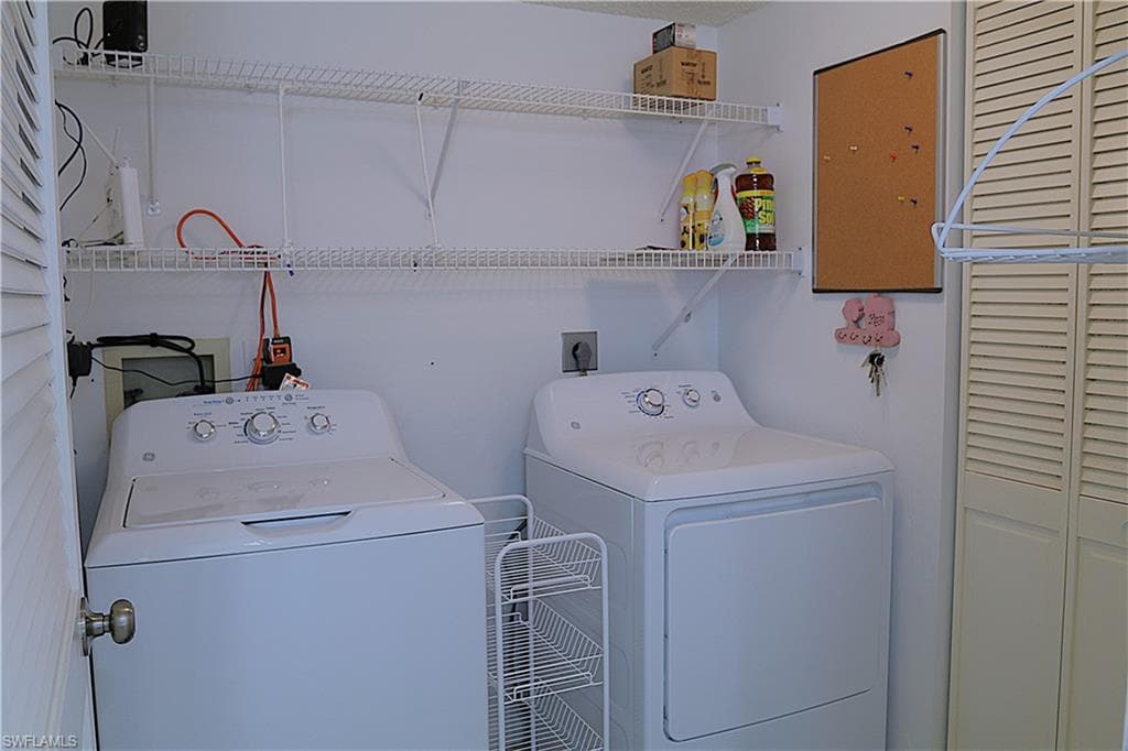 Laundry area featuring separate washer and dryer