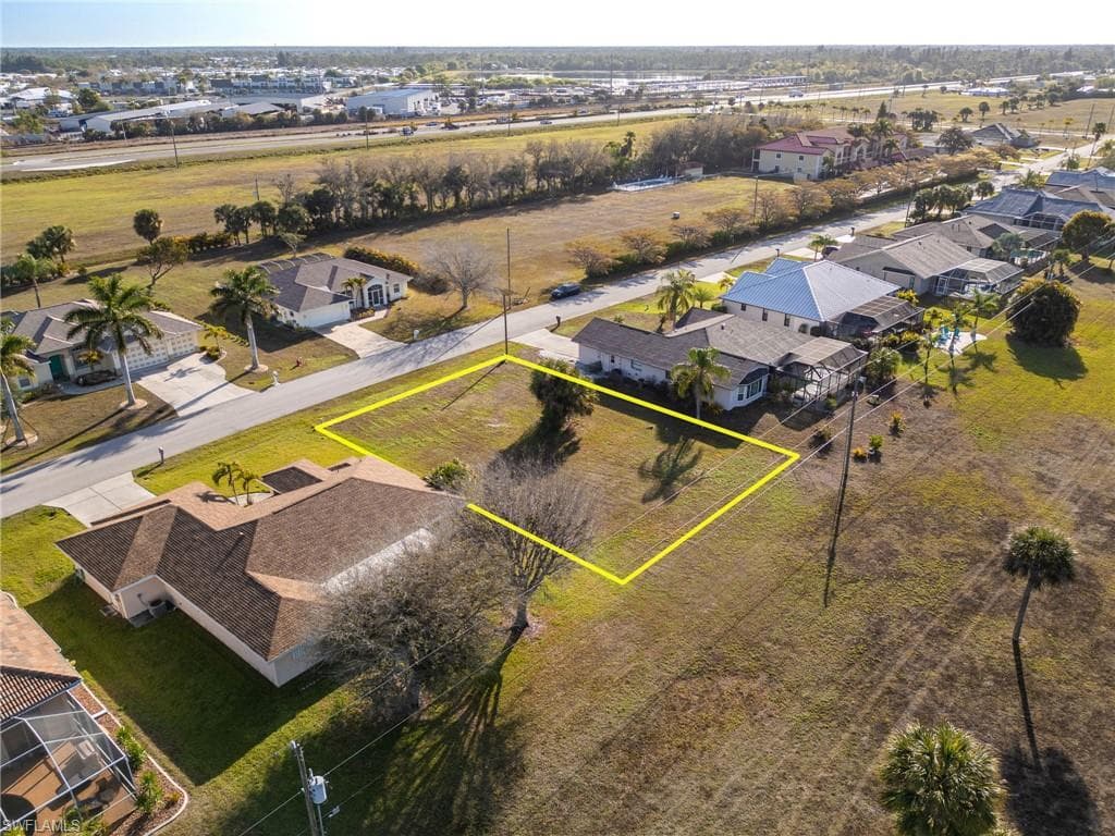 Aerial perspective of suburban area with property parcel outlined