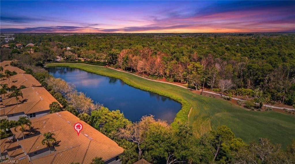 Aerial view at dusk of a water view and golf course view