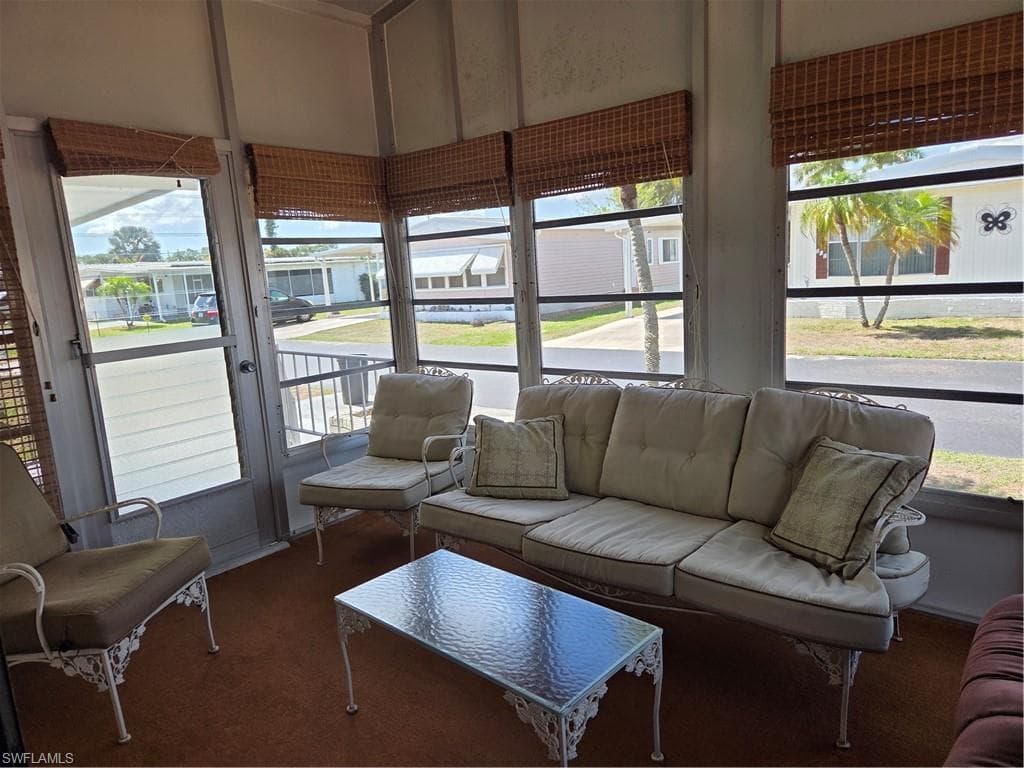 Sunny Florida Room features glass windows