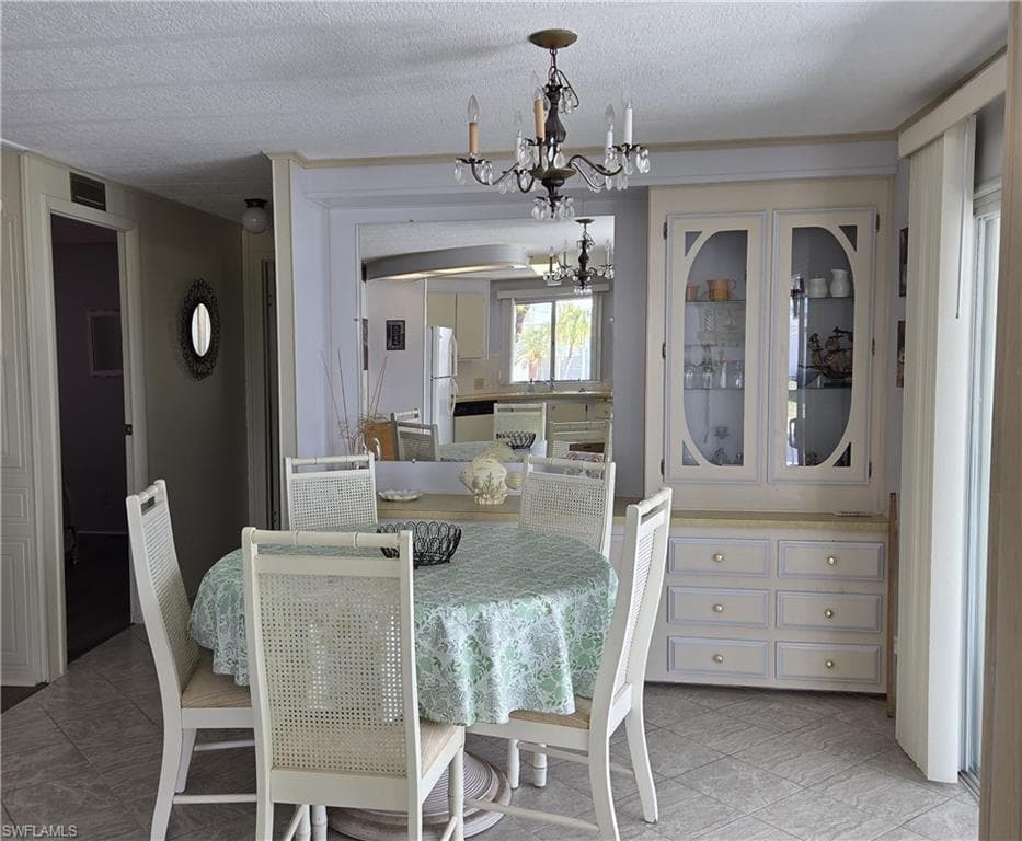 Dining area features mirrors and built-ins.