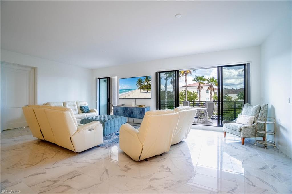 Living area featuring light marble finish flooring